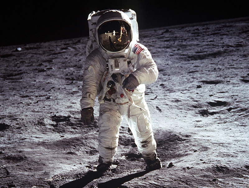 Iconic photograph of astronaut Buzz Aldrin, lunar module pilot, standing on the surface of the moon near the leg of the lunar module, Eagle, during the Apollo 11 moonwalk. Astronaut Neil Armstrong, mission commander, took this photograph with a 70mm lunar surface camera. 